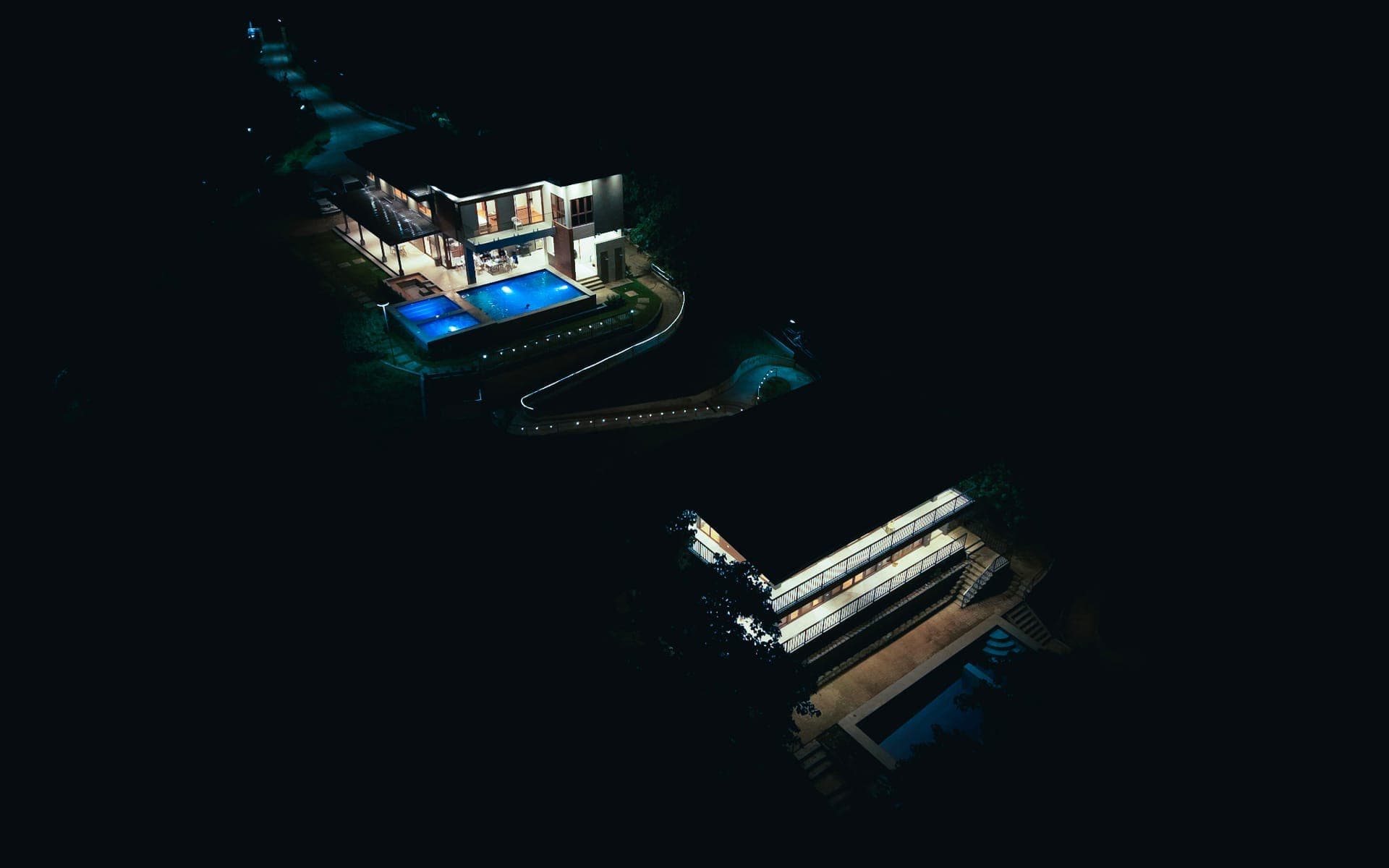 Top Hills View aerial view at night with illuminated pool